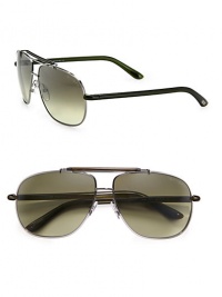 Iconic aviator style crafted in a sleek metal design. Available in shiny gun frames with olive green lenses.Metal100% UV ProtectionMade in Italy