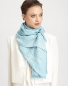 A subtle tonal, logo pattern design with a sweet, baby fringe.50% silk/50% cottonAbout 28 X 80Dry cleanImported 