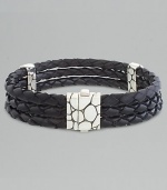 Sterling silver and three-row black leather woven bracelet. Spring clasp 8½ long Imported