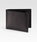 Sleek, slim design rendered in stamped calfskin leather.One billfold compartmentSix credit card slots4½ x 3¼Made in Italy