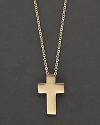 From the Tiny Treasures collection, a delicate pendant cross necklace in 18 Kt. yellow gold, with signature ruby accent. Designed by Roberto Coin. From the Tiny Treasures collection, a delicate pendant cross necklace in 18 Kt. yellow gold, with signature ruby accent. Designed by Roberto Coin.