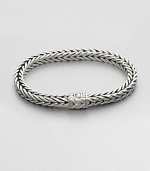 Small sterling silver bracelet in a squared, rope-weave pattern resembling herringbone, with push-lock closure.Sterling silverAbout 3 diam.Imported