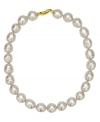 From the island of Mallorca, Spain, this necklace features white baroque organic man-made pearls (14 mm) set in 18k gold over sterling silver. Approximate length: 17 inches.