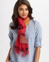 A semi-sheer, woven wrap in a colorblocked design with fringe trim.90% merino wool/10% acrylic80 X 26Hand washImported