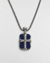 An original design pairs two sterling silver pendants on a single strand. The cross pendant is crafted with pavé diamond detail, and the larger features smooth lapis inlay. Sterling silver Pavé diamonds Lapis Pendant: 1 long Necklace: 24 long Lobster clasp closure Imported 