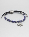 From the Batu Bedeg Collection. A beaded strand of carved silver and richly colored lapis is strung on a black fabric cord and highlighted by a stunning Star of David silver charm.LapisSterling silverAdjusts from about 6 to 9 longSliding bead closureMade in Bali