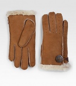 Keep your hands warm in this perforated shearling sheepskin design in soft suede or supple leather with button loop detail. About 8½ long Imported Fur origin: Spain