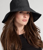 Floppy, water-resistant coated cotton is stylish for rainy days. Signature logo detail Brim, about 4¼ wide One size fits most Cotton; spot clean Imported