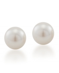 Nothing speaks to tradition more than a poignant pair of pearls. Smooth white glass pearl studs (8 mm) by Carolee are a timeless treasure. Crafted in gold-plated mixed metal.