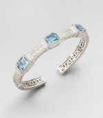 A highly intricate design with three emerald-cut blue topaz stones. Blue topazRhodium-plated sterling silverDiameter, about 2.25Slip-on styleImported 