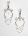 From the Superstud Collection. Beaded scrolls on top hold delicate, draped graduated chains in this sterling silver design that combines pretty shapes with edgy spike-and-stud details.Rhodium-plated sterling silverLength, about 2.5Post-and-hinge back with 14k yellow gold postImported