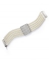 With a name like High Society, this bracelet was bound to exude elegance! Lauren by Ralph Lauren's luxurious five-row style combines shimmering glass pearls (6 mm) with a unique, glass-accented basket weave charm. Setting and slide closure crafted in silver tone mixed metal. Approximate length: 7-1/2 inches.