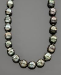 The new classic pearl necklace in lustrous Tahitian cultured pearls with slightly varying charcoal shades and sizes ranging from 8-12mm. With 14K white gold ball clasp. Measures 18. The new classic pearl necklace in lustrous Tahitian cultured pearls with slightly varying charcoal shades and sizes ranging from 8-12mm. With 14K white gold ball clasp. Measures 18.