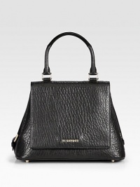 An beautiful shape in soft pebbled, lambskin leather.Top handle, 5½ dropMagnetic snap flap closureSnap button gussetsThree inside open pocketsLeather lining12W X 8½H X 6½DMade in Italy An beautiful shape in soft pebbled, lambskin leather.Top handle, 5½ dropMagnetic snap flap closureSnap button gussetsThree inside open pocketsLeather lining12W X 8½H X 6½DMade in Italy