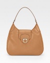 Sumptuously smooth leather crafted in a sleek, rounded silhouette with polished hardware.Shoulder strap, 9 dropToggle flap closureProtective metal feetOne inside zip pocketFully lined13½W X 9½H X 3DMade in Italy