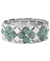 Infuse your look with the color of summer year round. Fossil's intricate diamond-patterned bracelet combines reconstituted semi-precious turquoise with silver tone mixed metal. Bracelet stretches to fit wrist. Approximate diameter: 2-1/2 inches.