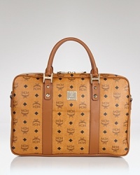 In logo-splashed canvas, this structured laptop tote from MCM makes a classic case for keeping your computer covered up. In logo-splashed canvas, this structured laptop tote from MCM makes a classic case for keeping your computer covered up.