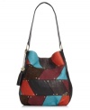 Bring a patchwork approach to your accessories arsenal with this groovy retro renegade from Roxy. Cool colors and edgy stud accents lend interest to the outside, while plenty of pockets offer praciality within.
