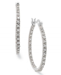 An elegant addition. These sterling silver hoop earrings from Victoria Townsend feature sparkling diamonds (1/4 ct. t.w.) for a stunning effect in any formal occasion. Approximate diameter: 1-1/8 inches. An elegant addition. These sterling silver hoop earrings from Victoria Townsend feature sparkling diamonds (1/4 ct. t.w.) for a stunning effect in any formal occasion. Approximate diameter: 1-1/8 inches.