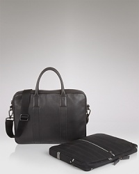 Ziptop leather briefcase with removable laptop sleeve. Miscellaneous slots inside, zip pocket. Adjustable grosgrain strap. Fully lined. Ziptop leather briefcase with removable laptop sleeve. Miscellaneous slots inside, zip pocket. Adjustable grosgrain strap. Fully lined.
