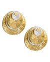 Stacked style adds the perfect, subtle touch. Kenneth Cole New York's unique stud earrings feature textured silver and gold tone mixed metal discs stacked on top of one another. Approximate diameter: 3/4 inch.