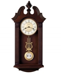 Stunning sophistication. Intricately carved, this walnut-finished wooden wall clock by Bulova features a gorgeous pendulum and plays Westminster or Wittington chimes on the quarter hour. Two-tone metal dial with Roman numerals and two hands features adjustable volume control and night shut-off. Stunning sophistication. Intricately carved, this walnut-finished wooden wall clock by Bulova features a gorgeous pendulum and plays Westminster or Wittington chimes on the quarter hour. Two-tone metal dial with Roman numerals and two hands features adjustable volume control and night shut-off.