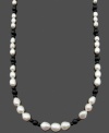 Chic contrasting colors. Cultured freshwater pearls (5-10 mm) and round onyx beads (4 mm and 6 mm) combine for a standout look on this sophisticated strand. Clasp crafted in 14k gold. Approximate length: 24 inches.