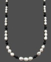 Chic contrasting colors. Cultured freshwater pearls (5-10 mm) and round onyx beads (4 mm and 6 mm) combine for a standout look on this sophisticated strand. Clasp crafted in 14k gold. Approximate length: 24 inches.