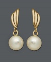 Polished pearls with vintage flair. These elegant earrings feature cultured freshwater pearls (7-1/2-8 mm) suspended from a timeless 14k gold setting. Approximate drop: 7/8 inch.