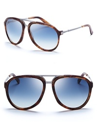 These vintage-inspired sunglasses from Gucci combine classic aviator frames with bold colors and mixed materials. These vintage-inspired sunglasses from Gucci combine classic aviator frames with bold colors and mixed materials.