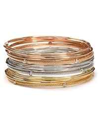 Stacked jewels reign supreme this season, so slip on this set of metallic bangles from RJ Graziano as an effortless way to tap into the trend. Stacked jewels reign supreme this season, so slip on this set of metallic bangles from RJ Graziano as an effortless way to tap into the trend.