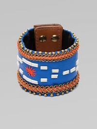 A wide cuff of bright leather, edged with golden beads and chains, stitched in colorful cord, with a center bugle-bead design.LeatherGoldtoneCotton backingLength, about 8½Width, about 2¾Stud snap closureImported A wide cuff of bright leather, edged with golden beads and chains, stitched in colorful cord, with a center bugle-bead design.LeatherGoldtoneCotton backingLength, about 8½Width, about 2¾Stud snap closureImported