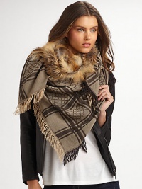A wool and silk blend with natural fox fur trimmed collar and metal horsebit hook closure. Natural fox fur collar Handkerchief hem Fringe border About 28 from shoulder to hem 70% wool/30% silk Dry clean Made in Italy Fur origin: Finland A wool and silk blend with natural fox fur trimmed collar and metal horsebit hook closure. Natural fox fur collar Handkerchief hem Fringe border About 28 from shoulder to hem 70% wool/30% silk Dry clean Made in Italy Fur origin: Finland