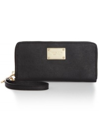Give your gadget a glam-over with gorgeous goodie from MICHAEL Michael Kors. Soft Saffiano leather is outfitted with signature hardware and convenient wristlet strap, while the pocket-interior stashes phone, cash, cards, and coins. Give your gadget a glam-over with gorgeous goodie from MICHAEL Michael Kors. Soft Saffiano leather is outfitted with signature hardware and convenient wristlet strap, while the pocket-interior stashes phone, cash, cards, and coins.