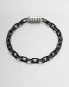 Intricate links of sterling silver and stainless steel offers a remarkably modern contrast to your classic, polished ensemble.Sterling silver/stainless steelAbout 3 diam.Imported