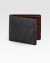 Taken from heritage suiting fabric, this wallet embodies a classic tailoring aesthetic and is French-edged with leather.One billfold compartmentSix card slotsCotton/leather4W x 4HImported