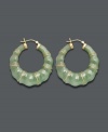 Good luck and great style combine in these unique hoop earrings. Crafted from solid jade (68 mm), earrings feature a bamboo-style pattern with 14k gold accents and backing. Approximate diameter: 1-1/2 inches.