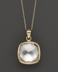 A bold, faceted crystal quartz glitters in a 14K yellow gold setting. A bold, faceted crystal quartz glitters in a 14K yellow gold setting.