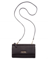 Classic styling with modern versatility, this Saffiano leather lovely from Calvin Klein converts from a casual crossbody to elegant evening bag in just two clicks. Outfitted with signature hardware and detailed stitching, it's the perfect day-to-night design. Classic styling with modern versatility, this Saffiano leather lovely from Calvin Klein converts from a casual crossbody to elegant evening bag in just two clicks. Outfitted with signature hardware and detailed stitching, it's the perfect day-to-night design.