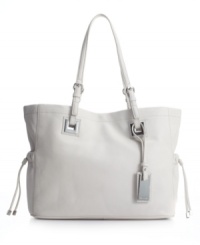 Roomy and refined, Calvin Klein's Exclusive tote walks the line between purse and briefcase with serious panache. Roomy and refined, Calvin Klein's Exclusive tote walks the line between purse and briefcase with serious panache.