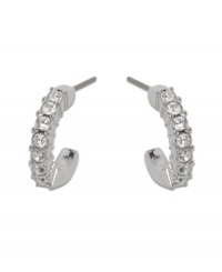 A hint of Swarovski sparkle adds just the right touch to your ensemble. 3/4 hoops feature sparkling clear crystals set in silver tone mixed metal. Approximate diameter: 1/2 inch. A hint of Swarovski sparkle adds just the right touch to your ensemble. 3/4 hoops feature sparkling clear crystals set in silver tone mixed metal. Approximate diameter: 1/2 inch.