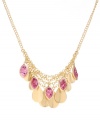 A swoop of statement-making sparkle. Kenneth Cole New York's chic cluster frontal necklace combines polished discs and crushed purple glass charms in gold tone mixed metal. Approximate length: 16 inches + 3-inch extender. Approximate drop: 1-1/2 inches.