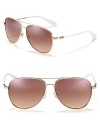 Classic aviator sunglasses with gradient lenses, contrast arms and signature logo detail along temples.