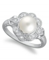 A fine display of poise and sophistication, this elegant cultured freshwater pearl ring (7 mm) presents a touch of vintage flair with the addition of diamond-studded (1/10 ct. t.w.) petals. Crafted in sterling silver. Size 7.