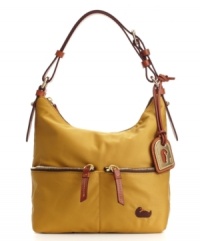 Dooney & Bourke takes their popular pocket purse silhouette and puts a new spin on it with a lightweight, nylon body that's available in a fresh crop of colors. Dooney & Bourke takes their popular pocket purse silhouette and puts a new spin on it with a lightweight, nylon body that's available in a fresh crop of colors.