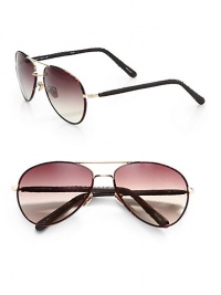 These covered metal frames feature snakeskin covered arms. Available in dark tortoise/gold with brown lens. 100% UV protectionImported These covered metal frames feature snakeskin covered arms. Available in dark tortoise/gold with brown lens. 100% UV protectionImported