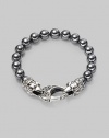 A new look for the modern man, handsomely crafted with a sterling silver raven's head clasp and a string of hematite beads. Sterling silver 10mm hematite beads Lobster clasp closure Bracelet, 9 long Imported 