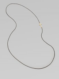 A simple oxidized sterling silver chain with a 14k gold cross, attached sideways for a modern look. 14k goldOxidized sterling silverLength, about 26Slip-on style Made in USA A simple oxidized sterling silver chain with a 14k gold cross, attached sideways for a modern look. 14k goldOxidized sterling silverLength, about 26Slip-on style Made in USA