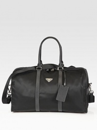 Large nylon duffel with Saffiano leather trim.Zip closureTop handlesAdjustable shoulder strapFully linedNylon19W x 10H x 9DMade in Italy Large nylon duffel with Saffiano leather trim.Zip closureTop handlesAdjustable shoulder strapFully linedNylon19W x 10H x 9DMade in Italy