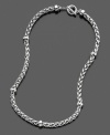 A cheerfully rustic sensibility shines from this beautifully braided, silvertone mixed metal necklace. Measures approximately 18 inches long.